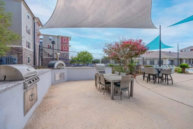 Grills outdoor dining tables seating area exterior at Arba in San Marcos Student Accommodation