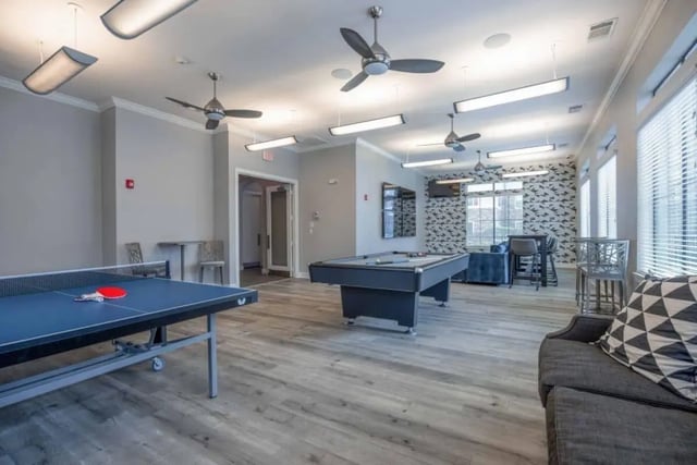 Ping pong table pool table seating living room at Arba in San Marcos Student Accommodation