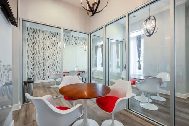 Modern communal area with table and chairs at Arba in San Marcos Student Accommodation