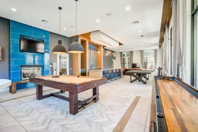 Pool table shuffleboard bar lounge area at The Mill at Auburn in Auburn Student Accommodation