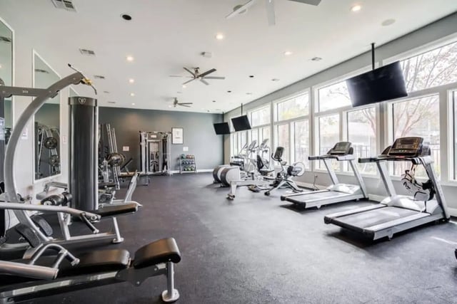 Treadmills weight machines rowing machine gym area at The Mill at Auburn in Auburn Student Accommodation
