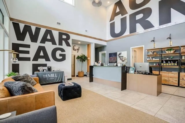 Reception area with seating and desk lobby at The Mill at Auburn in Auburn Student Accommodation