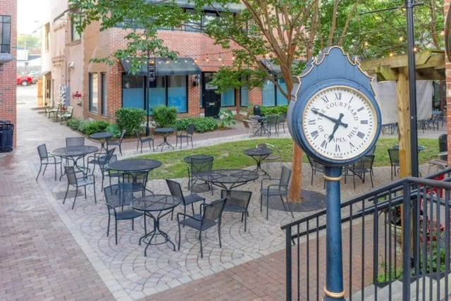 Courtyard seating with clock exterior at Courtyard Lofts in Chapel Hill Student Accommodation