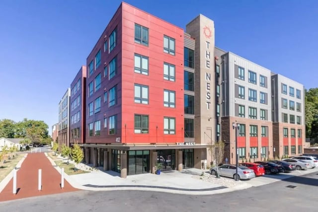 Modern apartment building with red and grey exterior exterior at The Nest At University Center in Rock Hill Student Accommodation