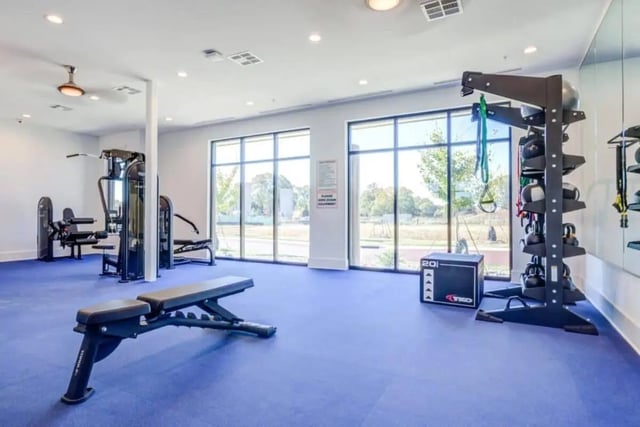 Weight rack bench and machines gym room at The Nest At University Center in Rock Hill Student Accommodation