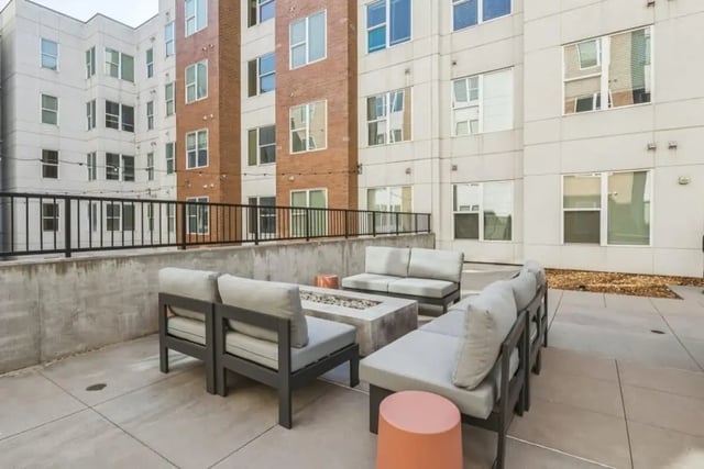 Sofa seating fire pit and stools outdoor patio exterior at Nova Knoxville in Knoxville Student Accommodation