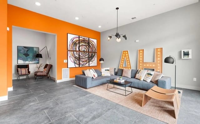Gray sectional sofa with decorative pillows living room at Nova Knoxville in Knoxville Student Accommodation