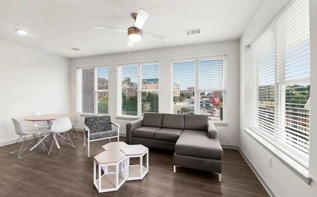 Sectional sofa dining table chairs accent chair living room at Nova Knoxville in Knoxville Student Accommodation