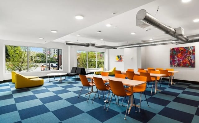 Orange chairs and tables in communal area at Nova Knoxville in Knoxville Student Accommodation