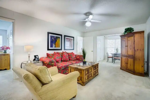 Sofa coffee table cabinet and art living room at University Woods in Raleigh Student Accommodation