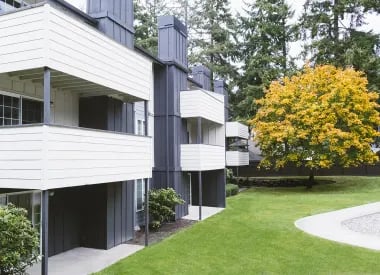 Modern building balconies green lawn autumn exterior at University Glen in Raleigh Student Accommodation