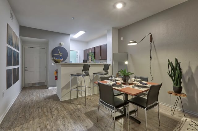 Dining table with chairs and bar stools living area at The Bryn in State College Student Accommodation