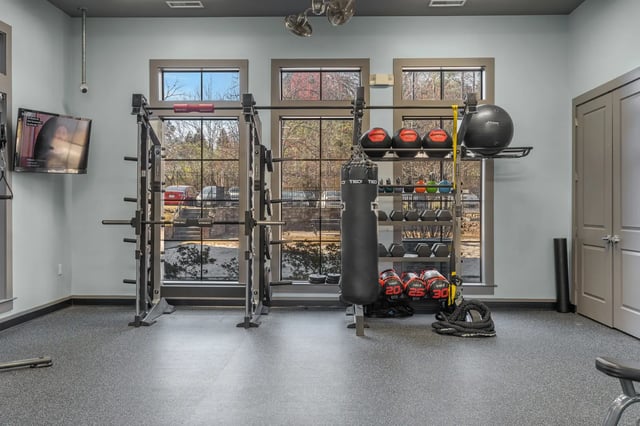 Weights racks punching bag gym equipment fitness area at University Village at 2505 in Raleigh Student Accommodation