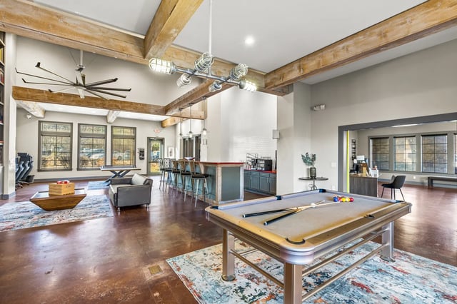 Pool table sofas and bar seating common area at University Village at 2505 in Raleigh Student Accommodation