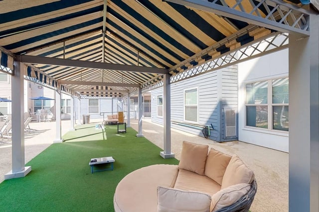 Round couch and jenga game outdoor area at Cherry Street in College Station Student Accommodation