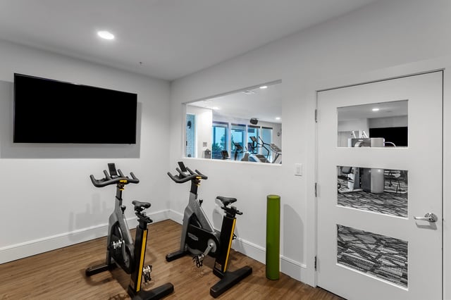 Exercise bikes and television gym area. at Berkeley House in College Station Student Accommodation