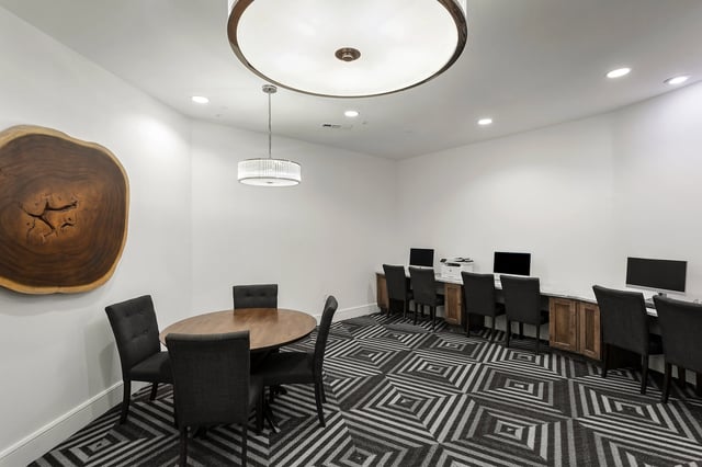 Computers tables chairs and artwork study area at Berkeley House in College Station Student Accommodation