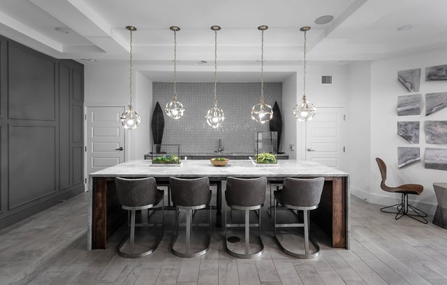 Island with bar stools modern pendant lights kitchen at Berkeley House in College Station Student Accommodation