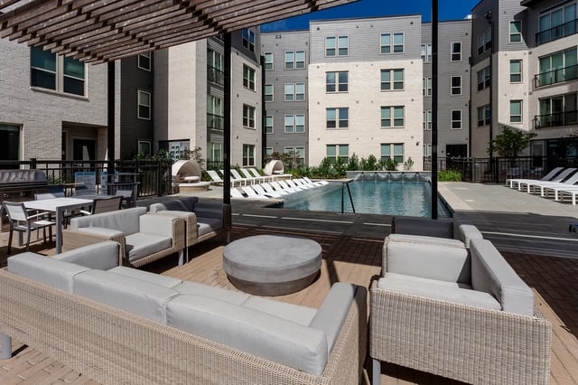 Outdoor lounge seating and pool area exterior at Berkeley House in College Station Student Accommodation