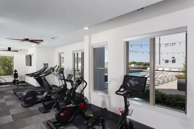Treadmills ellipticals and bikes gym equipment fitness center at The Hudson Northgate in College Station Student Accommodation