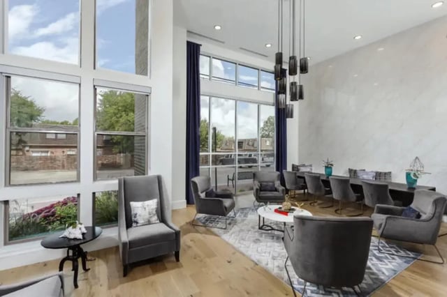 Chairs lounge area large windows marble wall living room at The Hudson Northgate in College Station Student Accommodation