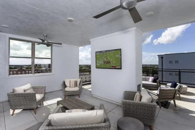 Outdoor seating TV and ceiling fans exterior at The Hudson Northgate in College Station Student Accommodation