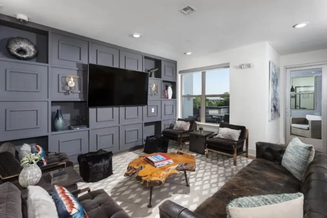 Modern lounge with television and comfortable seating living room at The Hudson Northgate in College Station Student Accommodation