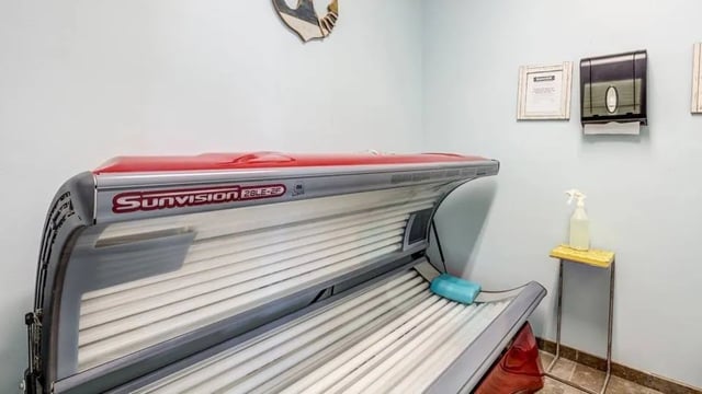 Sunvision tanning bed blue cushion spray bottle Tanning Room at The Hangout in Starkville Student Accommodation