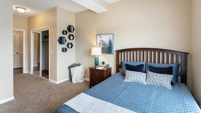 Bed nightstand closet sliding door bedroom at The Hangout in Starkville Student Accommodation