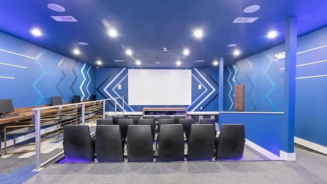 Theater room with chairs and computers Cinema at The Hangout in Starkville Student Accommodation