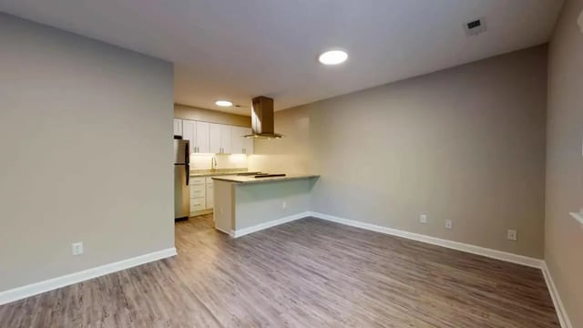 Kitchen island refrigerator cabinets range hood kitchen at 3116 Hillsborough in Raleigh Student Accommodation