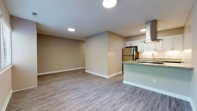 Kitchen living area with stainless steel refrigerator and cabinets living room at 3116 Hillsborough in Raleigh Student Accommodation