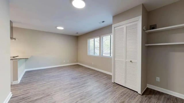 Kitchen counter vent two windows bi-fold doors shelves living room at 3116 Hillsborough in Raleigh Student Accommodation