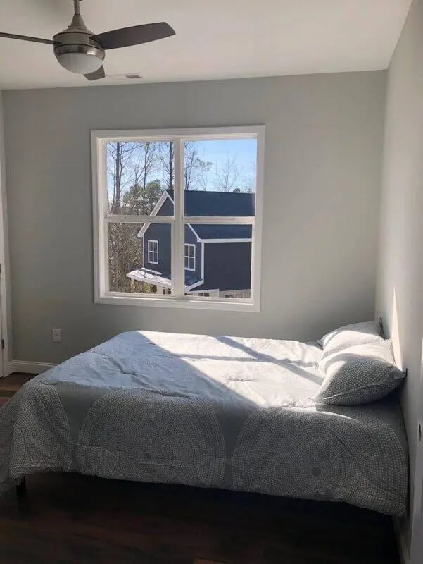 Bed with patterned duvet window and ceiling fan bedroom at The Lookout in Chapel Hill Student Accommodation