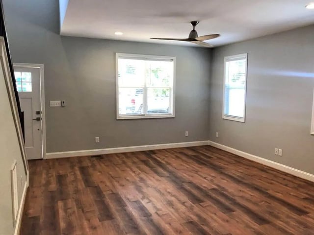 Empty room with wood floor ceiling fan door living room at The Lookout in Chapel Hill Student Accommodation
