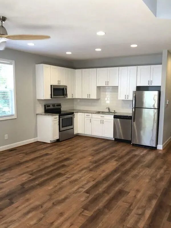 Stainless steel appliances and white cabinets kitchen at The Lookout in Chapel Hill Student Accommodation