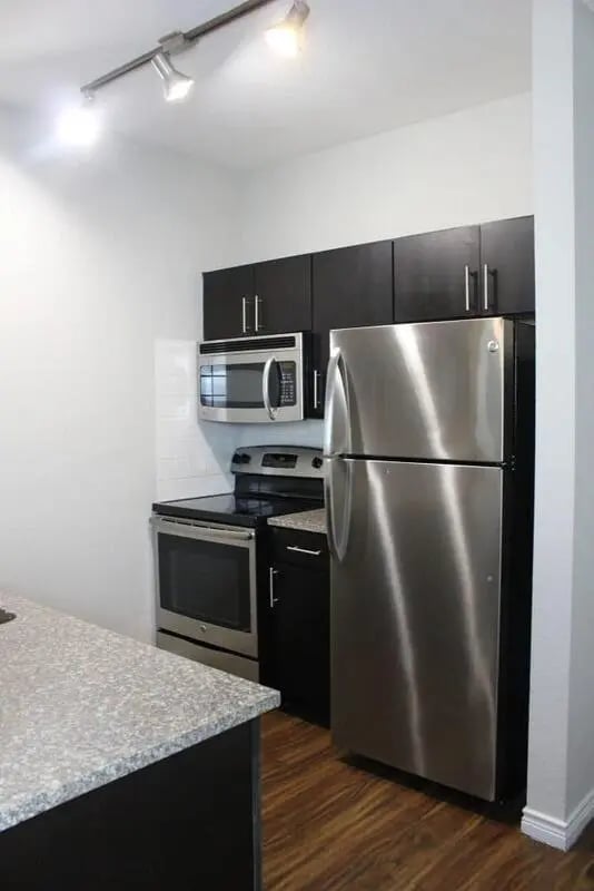 Stainless steel appliances granite counter kitchen at 21 Pearl in Austin Student Accommodation