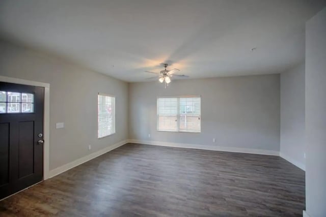Dark door blinds and wooden floor living room at The Collective at Kennesaw in Kennesaw Student Accommodation
