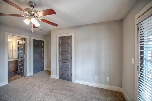 Bedroom with ceiling fan and two doors at The Collective at Kennesaw in Kennesaw Student Accommodation