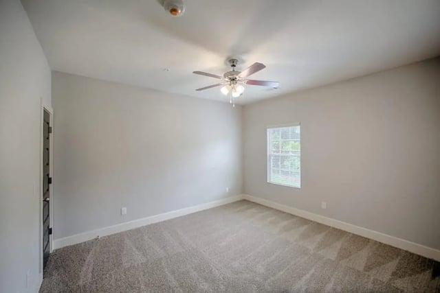 Empty carpeted room with window and fan Bedroom at The Collective at Kennesaw in Kennesaw Student Accommodation