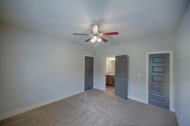 Empty room with ceiling fan and bathroom entrance Bedroom at The Collective at Kennesaw in Kennesaw Student Accommodation