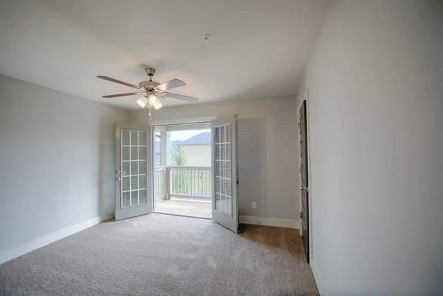 Ceiling fan French doors open to balcony living room at The Collective at Kennesaw in Kennesaw Student Accommodation