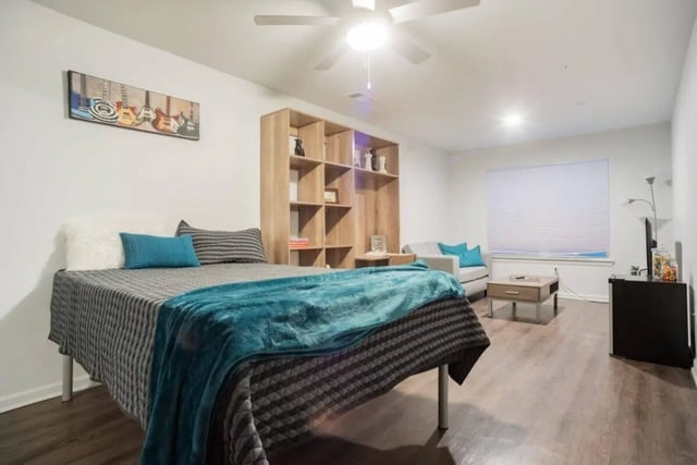 Bed shelving sofa coffee table living room at Sparq On Rio in Austin Student Accommodation