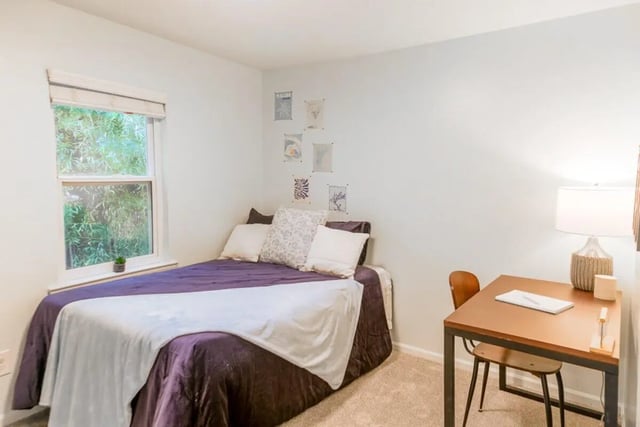 Bed desk chair lamp and window bedroom at Logan Square in Auburn Student Accommodation