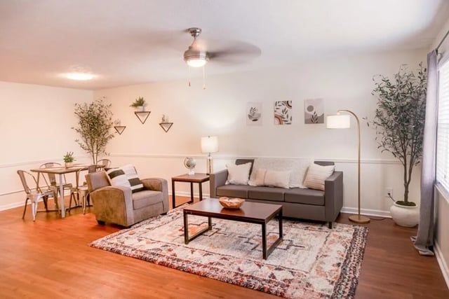 Sofa armchair coffee table dining set living room at Logan Square in Auburn Student Accommodation