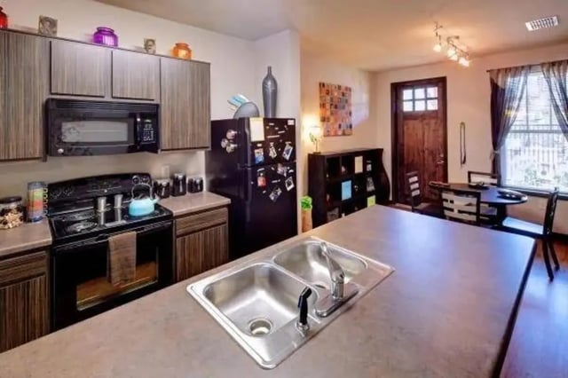 Kitchen with oven microwave refrigerator sink dining table kitchen at Block 43 in Greensboro Student Accommodation