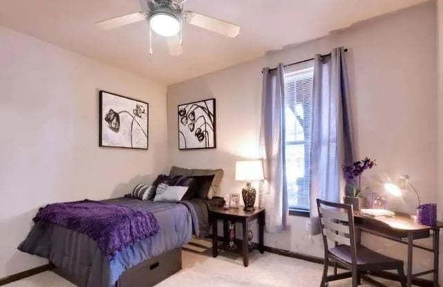 Bed desk window and ceiling fan bedroom at Block 43 in Greensboro Student Accommodation
