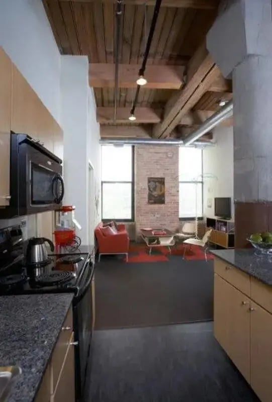 Kitchen with microwave stove and seating area living room at The Letterman Chicago in Chicago Student Accommodation
