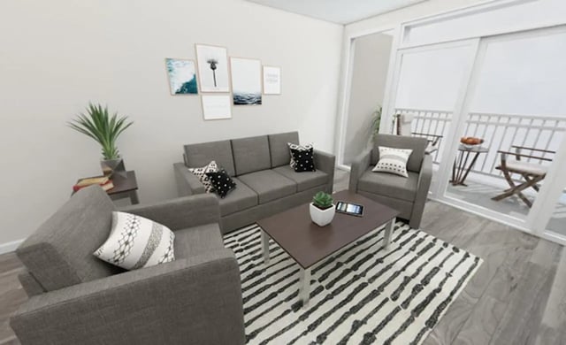 Sofa chairs coffee table with tablet living room at Lofts at Gold Street in Rochester Student Accommodation