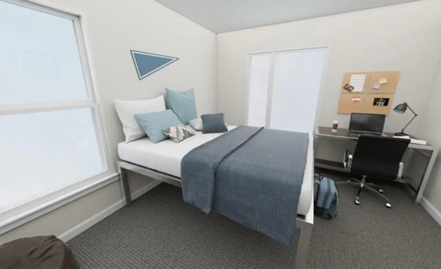 Bed desk chair with laptop and corkboard Bedroom at Lofts at Gold Street in Rochester Student Accommodation